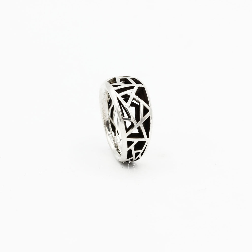 A silver ring with an intricate labyrinth pattern.