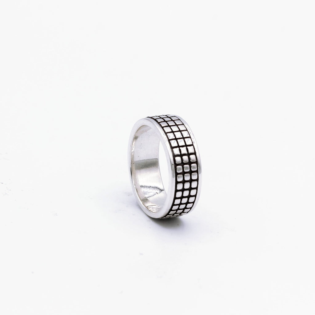A silver ring with a geometric grid pattern